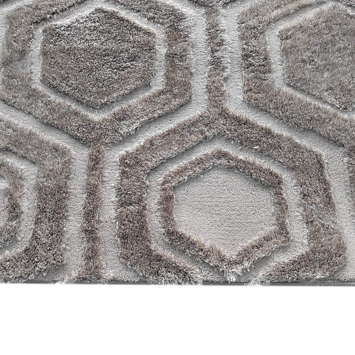 Bruin geometrisch vloerkleed met hexagon patroon voor woonkamer.