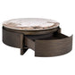 Ronde salontafel met marmeren blad en lade, donker houtafwerking.