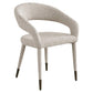 Moderne eetkamerstoel Gia in naturel chunky stof met zwarte poten.