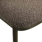 Eetkamerstoel Gandy met bruine chunky bekleding en zwart metalen frame.