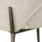 Close-up van de Kenzi biscotti eetkamerstoel met stoffen bekleding en zwart metalen poten.