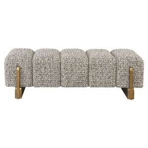 Bank Caleo Cobblestone bank met gouden poten en textuurrijke bekleding.